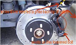 my .rtf doc detailing changing rear pads with pics-swing-back-caliper-top.jpg