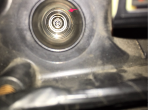 piece of rubber stuck behind spark plug-obj1.png