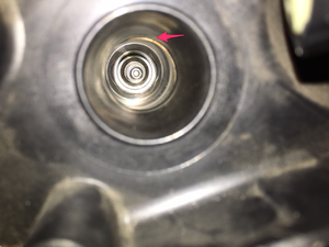 piece of rubber stuck behind spark plug-obj2.png