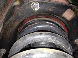 Sounds like something flopping around....-upper-bushing.jpg