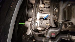 replaced thermostat, some squealing and some coolant leak-leak-after-thermostat-replacement.jpg