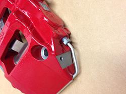 Aluminum block on lower inboard side of Alcon Calipers-photo-1.jpg