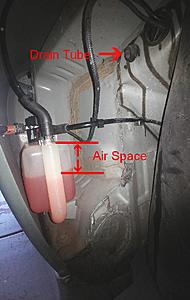 Sub-Windshield Drain and Overflow Tank Questions-windshield-drain-behind-liner.jpg