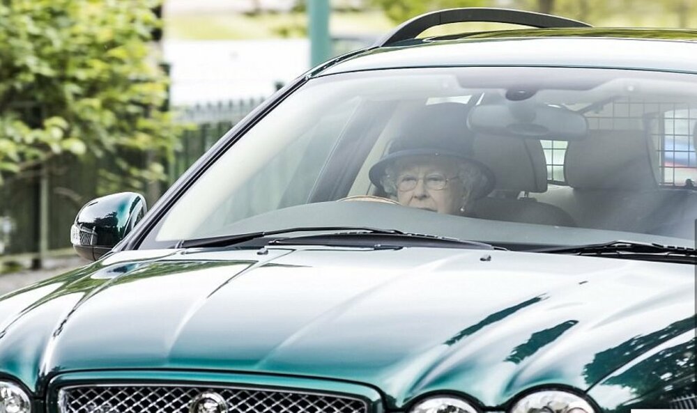 Queen Elizabeth II in a Jaguar